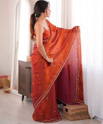 Orange tissue satin sequins saree with unstitched blouse piece. 5