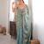 Sky tissue satin sequins saree with unstitched blouse piece.