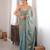 Sky tissue satin sequins saree with unstitched blouse piece.