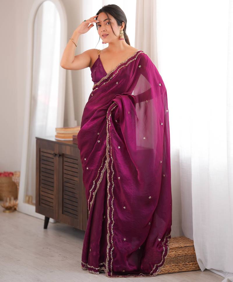 Wine tissue satin sequins saree with unstitched blouse piece.