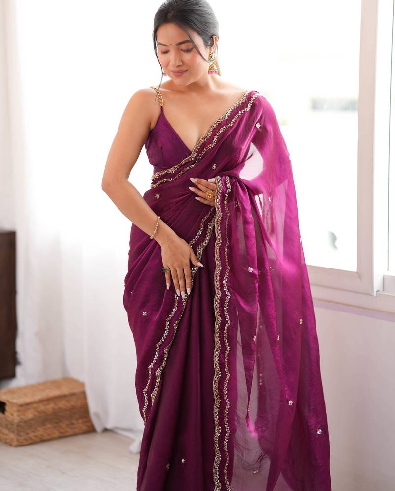 Wine tissue satin sequins saree with unstitched blouse piece.