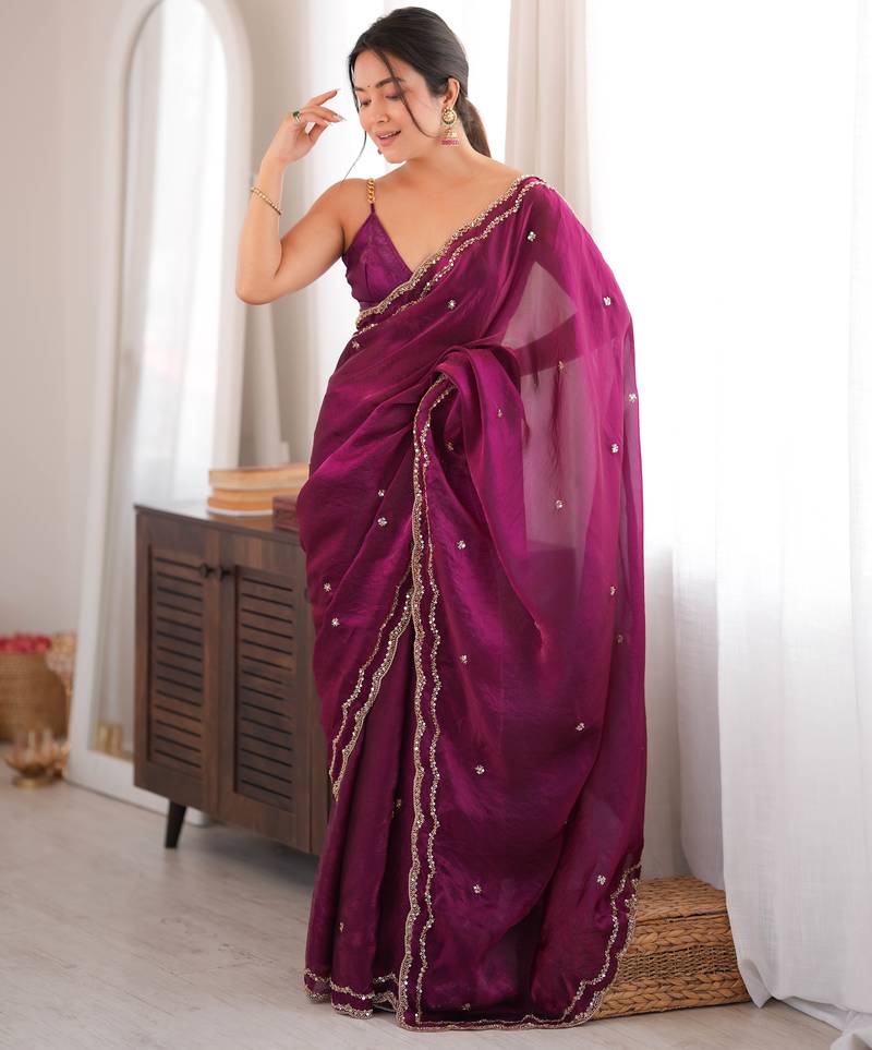 Wine tissue satin sequins saree with unstitched blouse piece.
