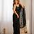 Black tissue satin sequins saree with unstitched blouse piece.