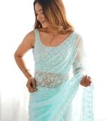 Sky blue tissue satin sequins saree with unstitched blouse piece.