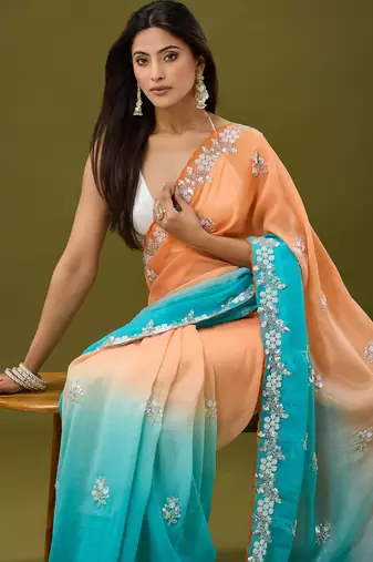 Orange & sky blue tissue satin embellished saree with unstitched blouse piece.