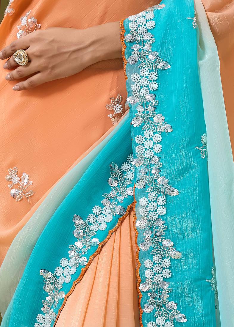 Orange & sky blue tissue satin embellished saree with unstitched blouse piece.