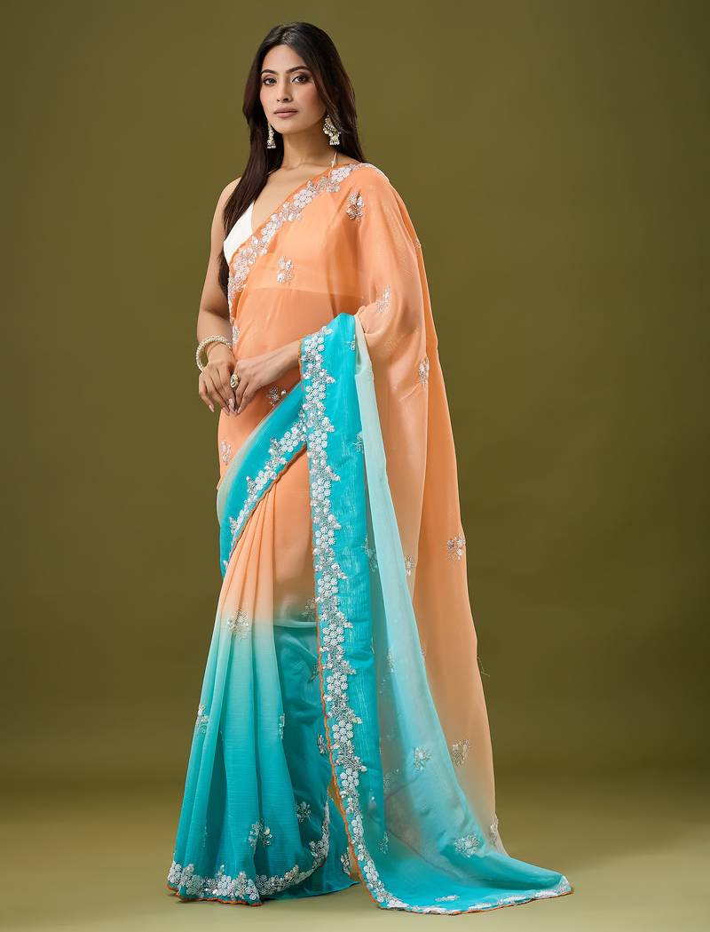 Orange & sky blue tissue satin embellished saree with unstitched blouse piece.