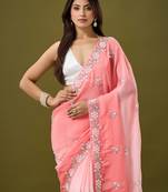 Peach tissue satin embellished saree with unstitched blouse piece.