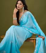 Blue tissue satin embellished saree with unstitched blouse piece.