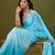 Blue tissue satin embellished saree with unstitched blouse piece.