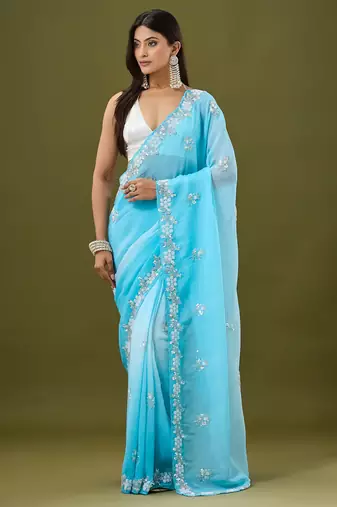 Blue tissue satin embellished saree with unstitched blouse piece.