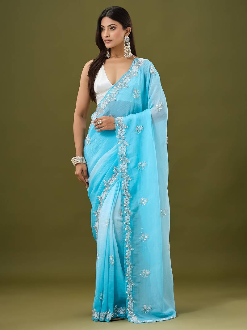 Blue tissue satin embellished saree with unstitched blouse piece.