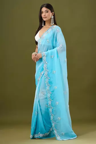 Blue tissue satin embellished saree with unstitched blouse piece.