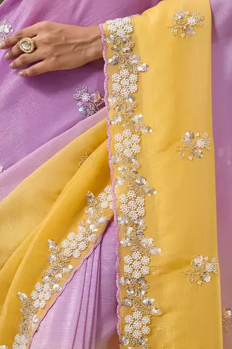 Lavender tissue satin embellished saree with unstitched blouse piece.