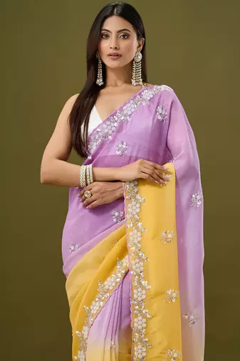 Lavender tissue satin embellished saree with unstitched blouse piece.