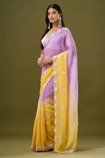 Lavender tissue satin embellished saree with unstitched blouse piece.