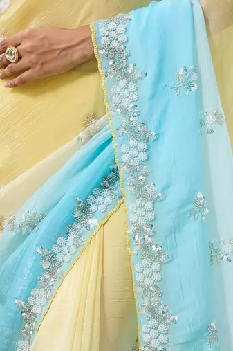 Yellow & sky blue tissue satin embellished saree with unstitched blouse piece.