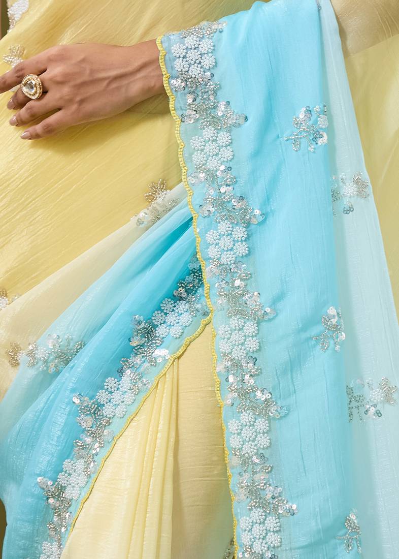 Yellow & sky blue tissue satin embellished saree with unstitched blouse piece.