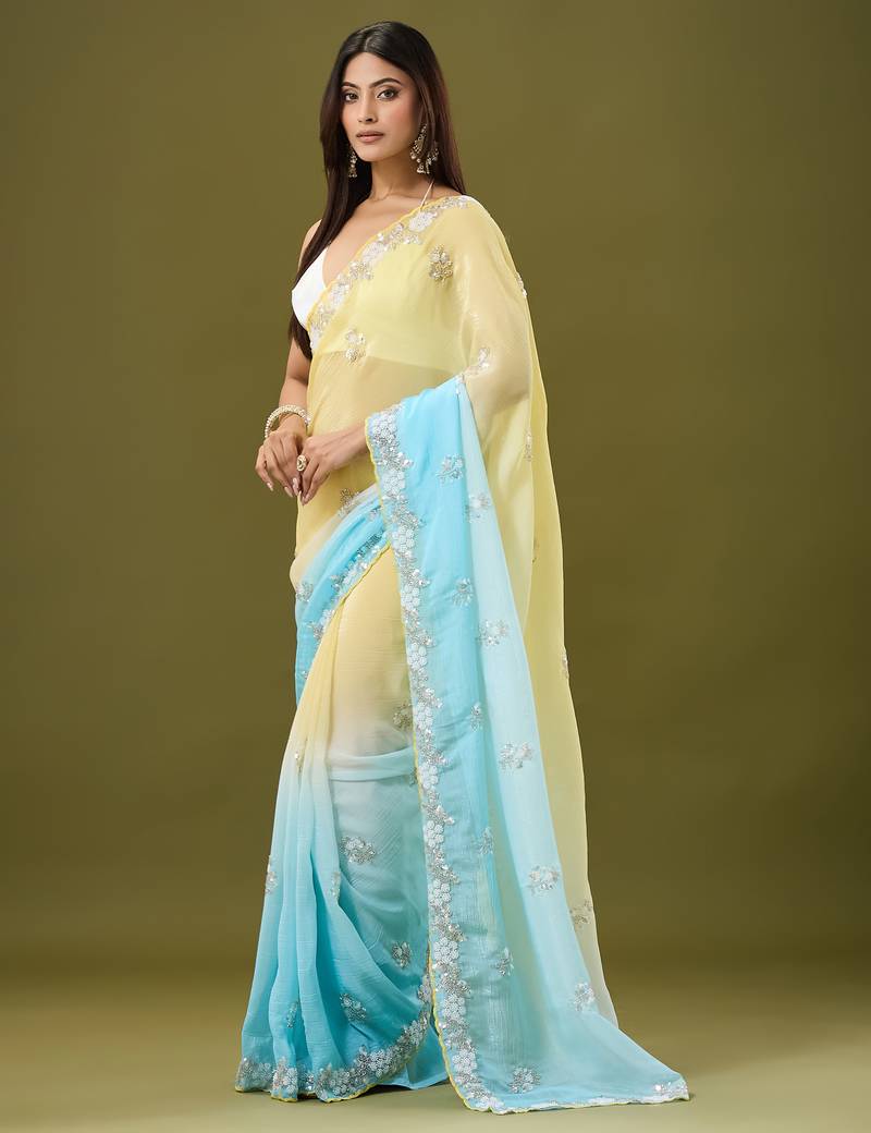 Yellow & sky blue tissue satin embellished saree with unstitched blouse piece.