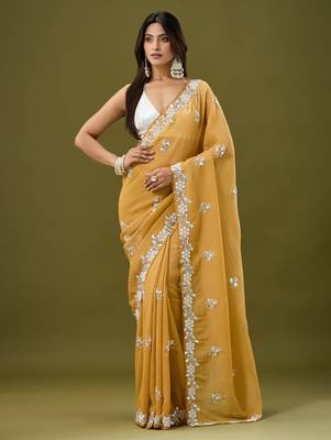 Mustard tissue satin embellished saree with unstitched blouse piece. 2