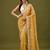 Mustard tissue satin embellished saree with unstitched blouse piece.