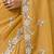 Mustard tissue satin embellished saree with unstitched blouse piece.