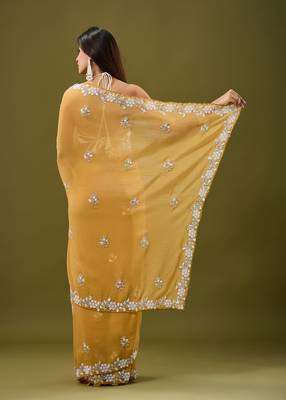 Mustard tissue satin embellished saree with unstitched blouse piece. 5