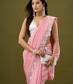 Pink tissue satin embellished saree with unstitched blouse piece.