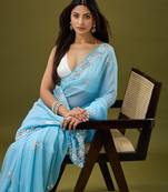 Sky blue tissue satin embellished saree with unstitched blouse piece.