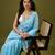 Sky blue tissue satin embellished saree with unstitched blouse piece.