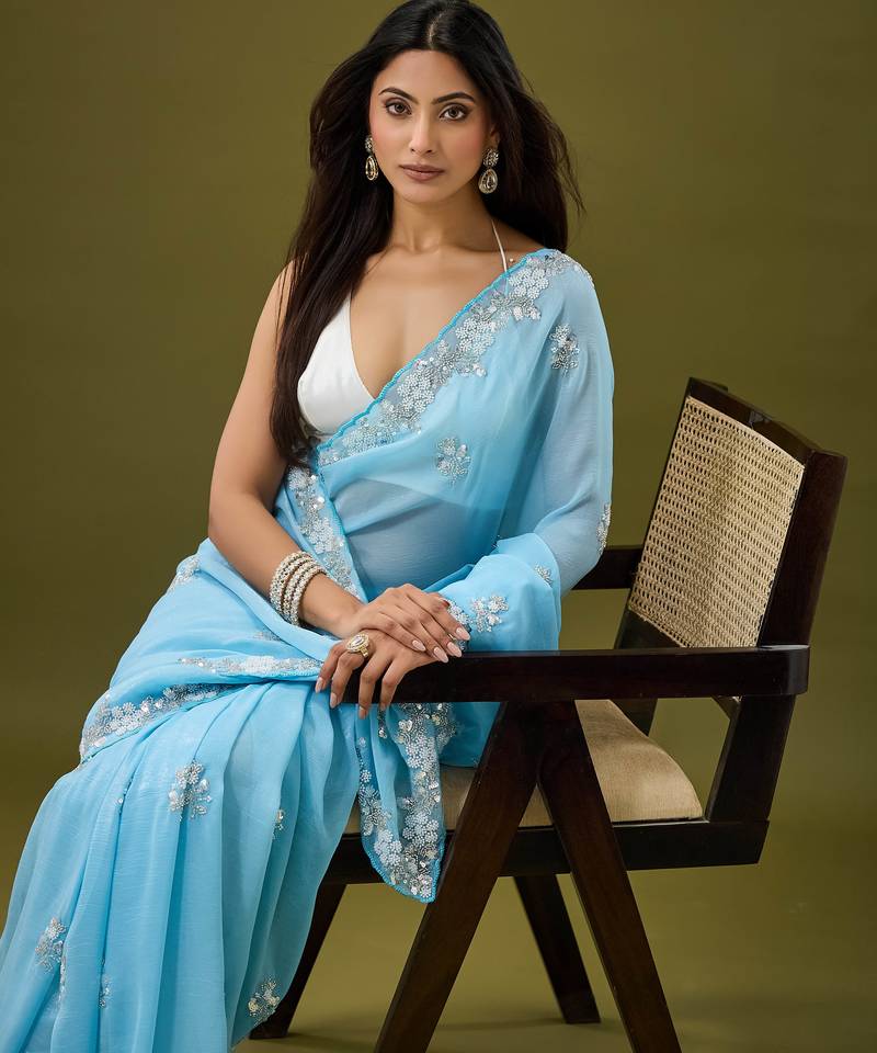 Sky blue tissue satin embellished saree with unstitched blouse piece.
