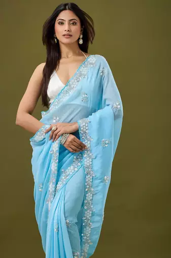Sky blue tissue satin embellished saree with unstitched blouse piece.