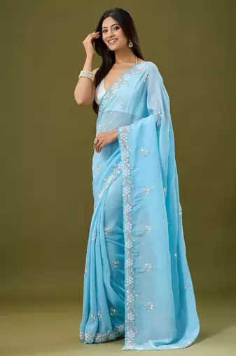 Sky blue tissue satin embellished saree with unstitched blouse piece.