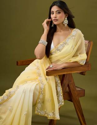 Yellow tissue satin embellished saree with unstitched blouse piece. 1