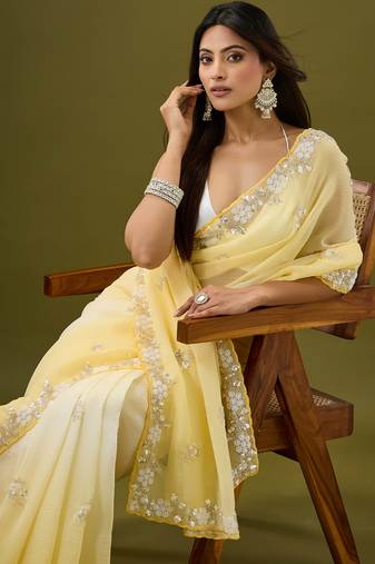 Yellow tissue satin embellished saree with unstitched blouse piece.