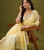 Yellow tissue satin embellished saree with unstitched blouse piece.