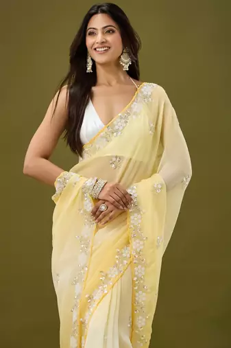 Yellow tissue satin embellished saree with unstitched blouse piece.