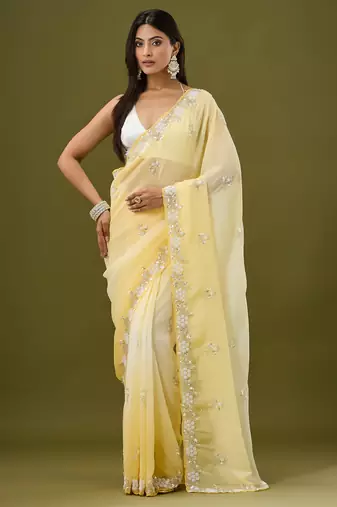 Yellow tissue satin embellished saree with unstitched blouse piece.