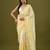 Yellow tissue satin embellished saree with unstitched blouse piece.