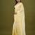 Yellow tissue satin embellished saree with unstitched blouse piece.