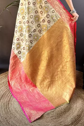 cream silk blend saree with unstitched blouse piece.
