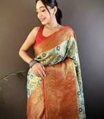 green silk blend saree with unstitched blouse piece.