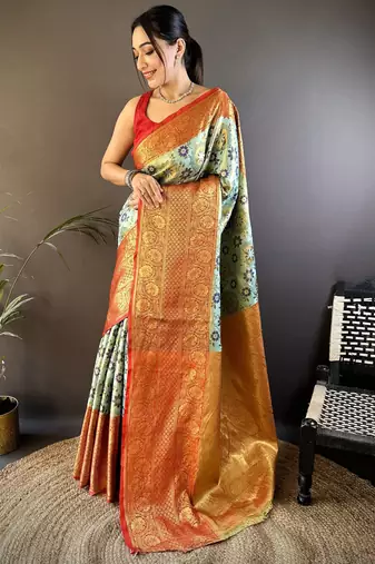 green silk blend saree with unstitched blouse piece.