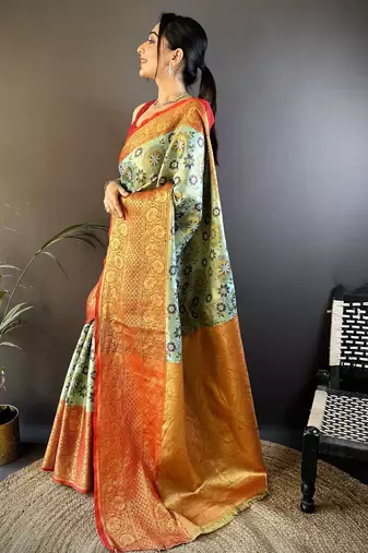 green silk blend saree with unstitched blouse piece.