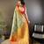 green silk blend saree with unstitched blouse piece.