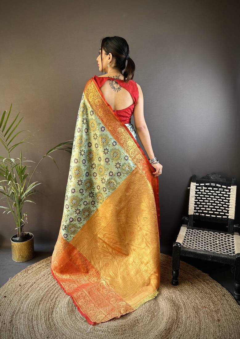 green silk blend saree with unstitched blouse piece.