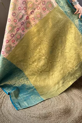 peach silk blend saree with unstitched blouse piece.