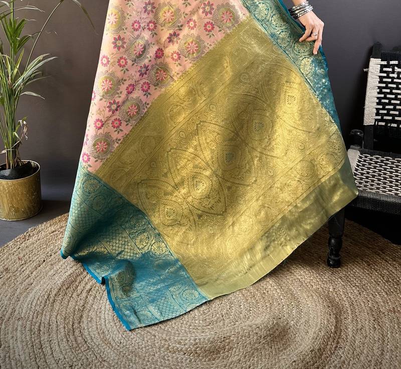 peach silk blend saree with unstitched blouse piece.