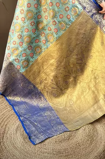 sky blue silk blend saree with unstitched blouse piece.