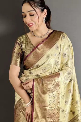 cream kanjeevaram silk blend zari woven saree with unstitched blouse piece.